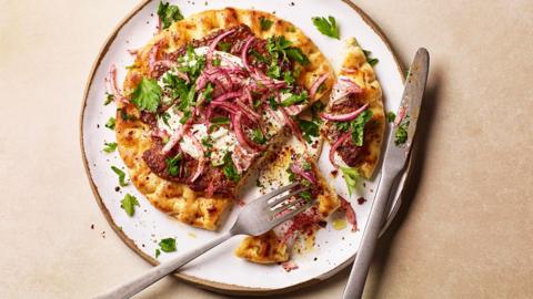 A plate of Smashed lamb flatbreads.