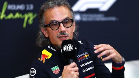 Laurent Mekies speaks into a microphone