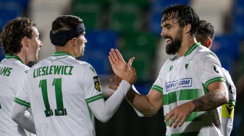 Saints' Jordan Williams (right) celebrates his late goal