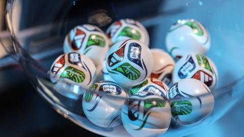 A close-up picture showing some of the World Cup draw balls from December