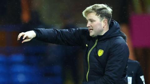 Tom Hounsell issues instructions from the touchline during a game