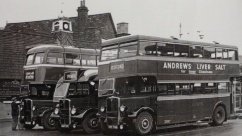A black and white photos of several buses at Oxford Bus Station