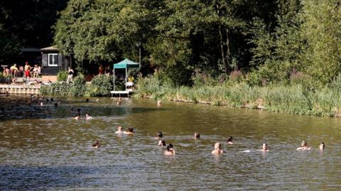 Scenes of the Hampstead Heath bathing ponds in North London