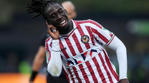 Michael Reindorf celebrates after scoring for Newport