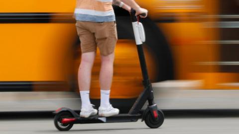 Man riding e-scooter