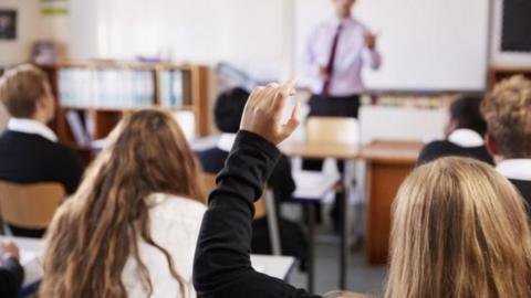 Teacher and pupils in class