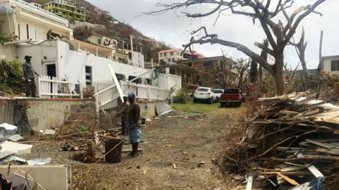 People clear damage in Tortola