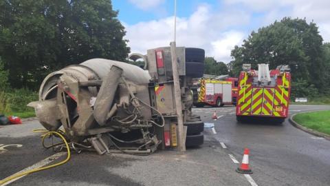 Overturned lorry on road