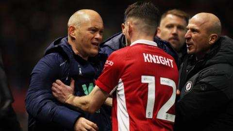 Alex Neil and Jason Knight clash on the sidelines after Millwall v Bristol City at Ashton Gate