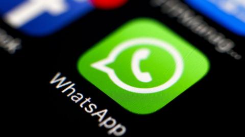 Image of the WhatsApp logo on a phone screen