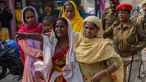 Women react after police arrest their relatives near Mayong police station in Morigaon district on 4 February