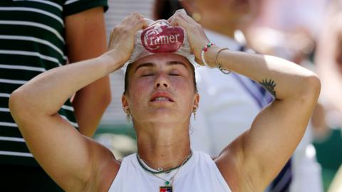 Aryna Sabalenka puts ice on her head to cool down during her Wimbledon semi-final loss to Amanda Anisimova