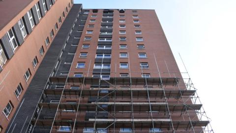 Scaffolding outside a tall tower block in Bristol.