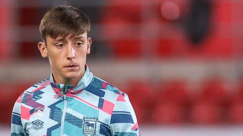 Cameron Humphreys warming up for Ipswich Town