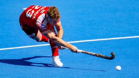 England’s Nick Bandurak scores against France