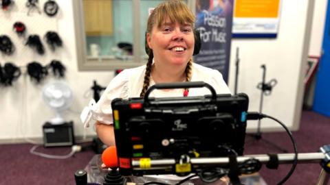 The virtual reality controller allows Mary-Louise to make upper body movements to compose her own music