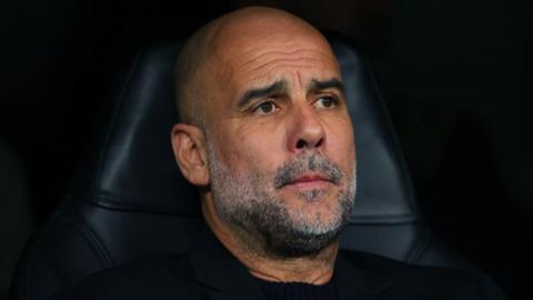 Man City boss Pep Guardiola looks sad