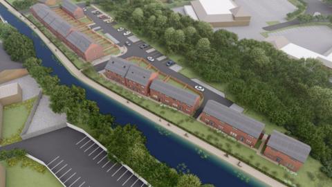 An animated-style image of a row of buildings to the right of a canal with greenery behind. On the left side of the canal there are trees, grass and an area with parking spaces.