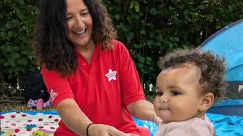 Action for Children staff member and her child