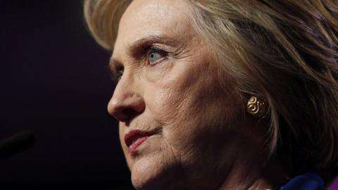 Hillary Clinton pauses during a speech