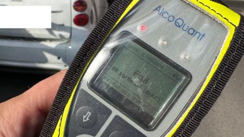 Police hand-held breathalyser testing equipment showing person had failed test and was over the drink-drive limit for alcohol consumption.
