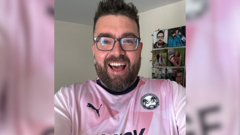 Kevin Chapman wearing a Peterborough United top