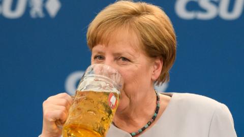 German Chancellor Angela Merkel drinks beer in Munich. Photo: 28 May 2017