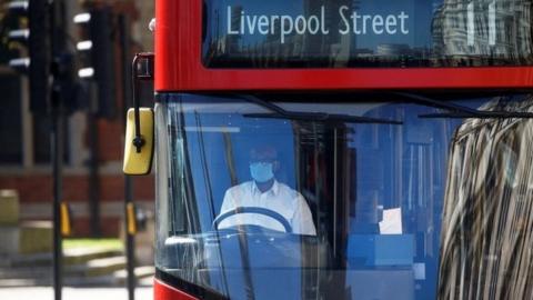 Bus driver with face mask