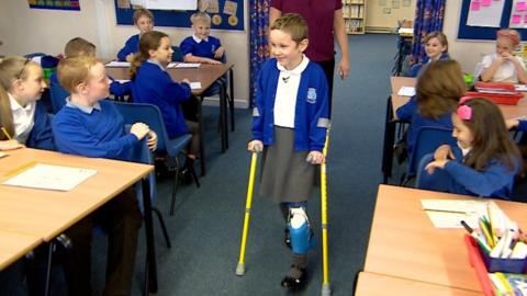 Amelia Eldred walking into her classroom