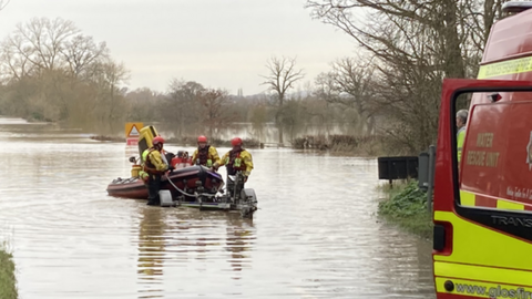 People being rescued from flooding