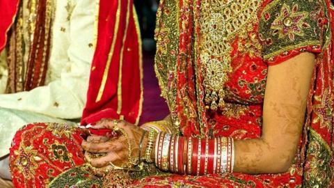 A bride and groom on their wedding day.