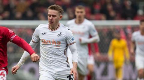 Ollie Cooper in action for Swansea City last season