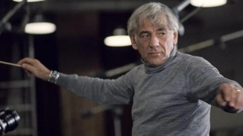 Black and white image of Leonard Bernstein conducting in 1974