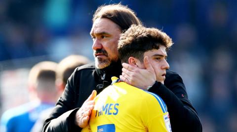 Daniel Farke hugs Dan James after defeat