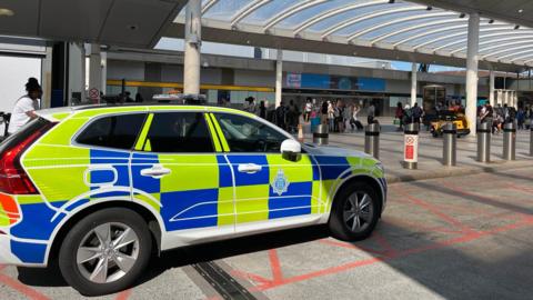 A police vehicle outside the terminal at Gatwick