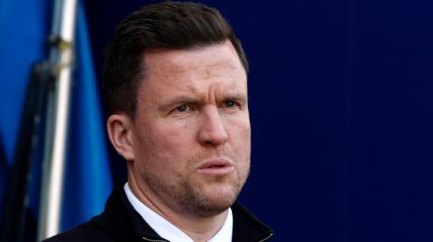 Gary Caldwell on the touchline