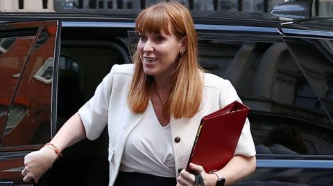 Angela Rayner gets out of a car in Downing Street, as she arrives for a cabinet meeting