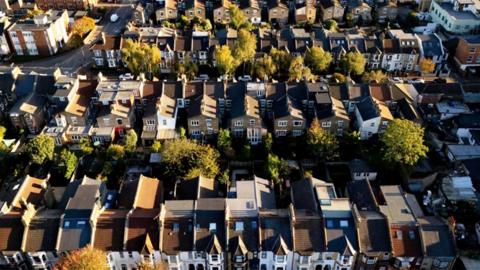 An aerial view of about 100 houses
