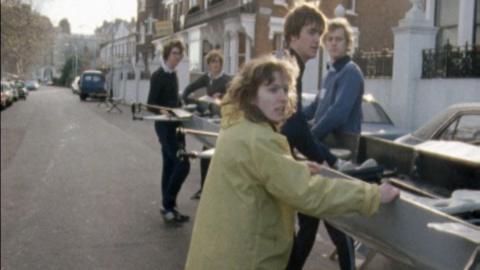 Sue Brown and the Oxford rowing team carrying a boat.