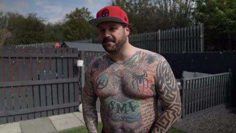 Man covered in tattoos