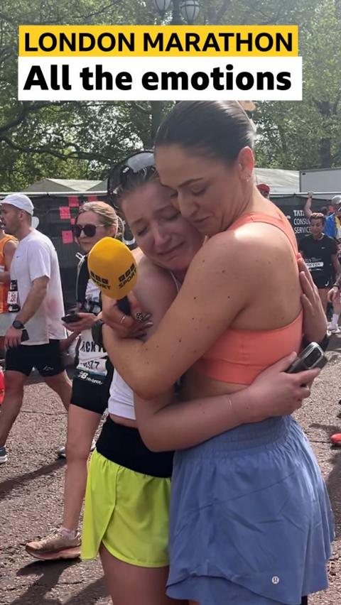 BBC Sport's Milly Pickles hugs a finisher of the London Marathon