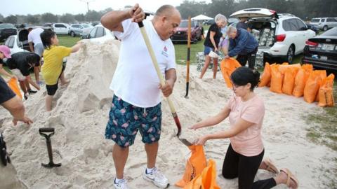 People in Florida fill sandbags ahead of the arrival of Hurricane Milton