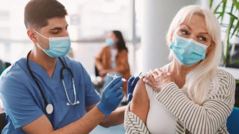 Woman being vaccinated