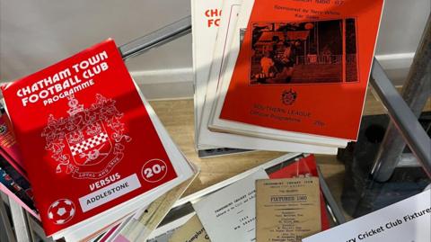 A pile of collectable football programmes for Chatham Town Football Club.