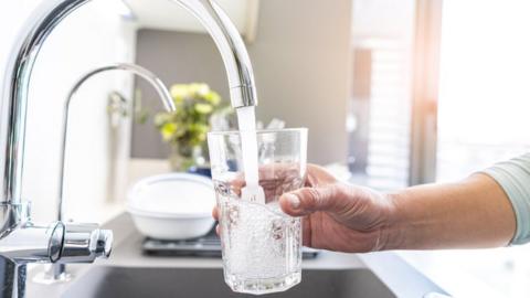 Person drinking tap water
