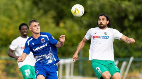 Penybont's Noah Daley  in action against Anton Tolordava of Kauno Žalgiris.