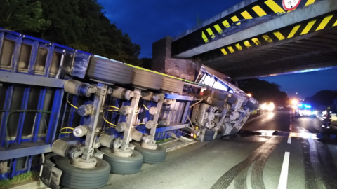 A lorry on its side on the A5