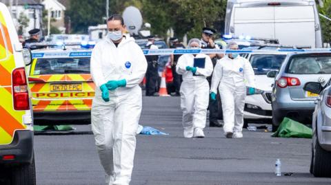 Police scenes-of-crime officers at the scene in Southport where three girls were fatally stabbed at a dance class.