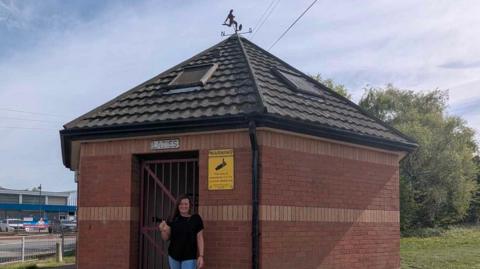 Carly Booth stood outside a toilet block in Ilkeston