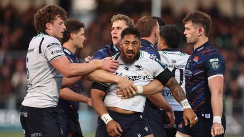 Bundee Aki is held by Duhan van der Merwe